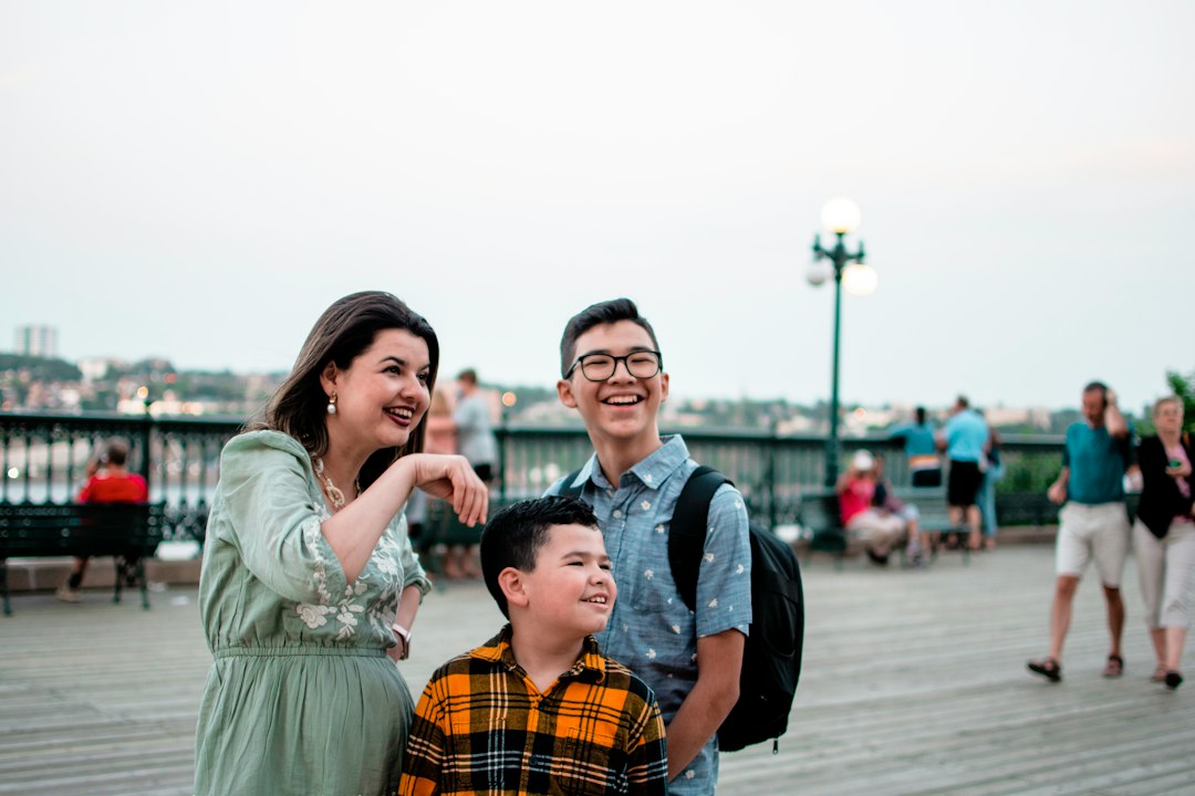A family smiling at their Edmonton dental clinic