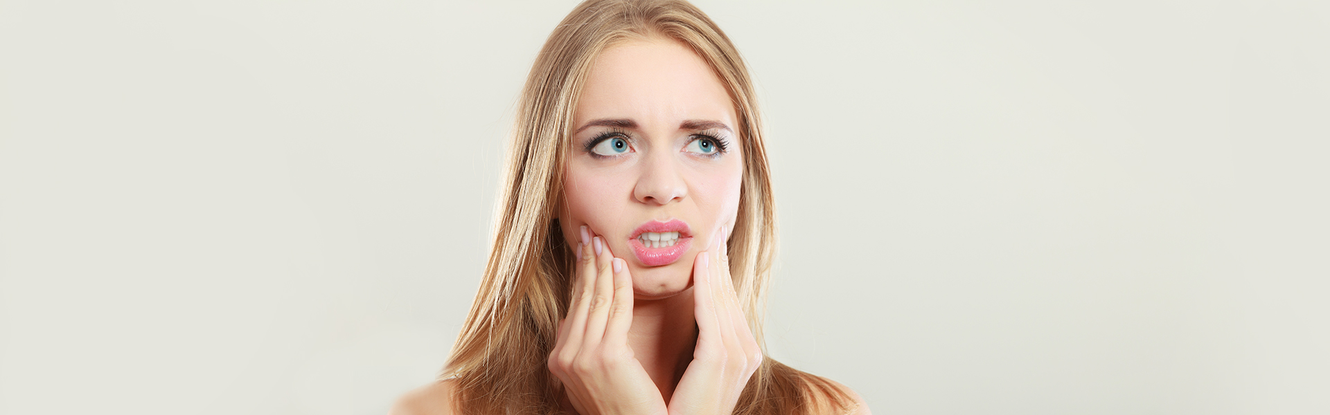 Girl suffering from teeth sensitivity.