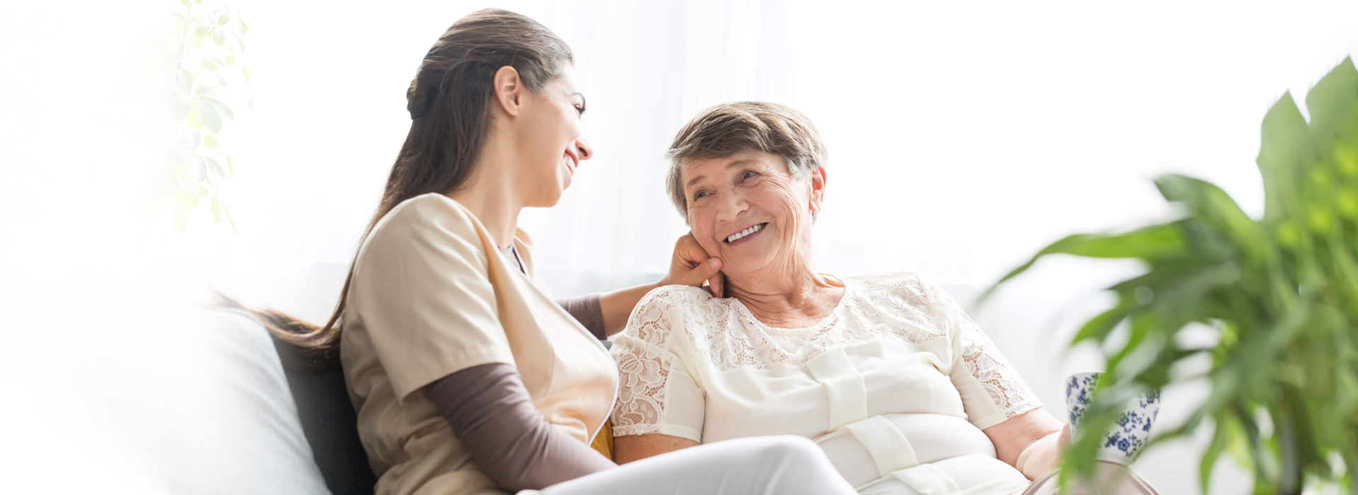 Smiling girl with a elderly woman.