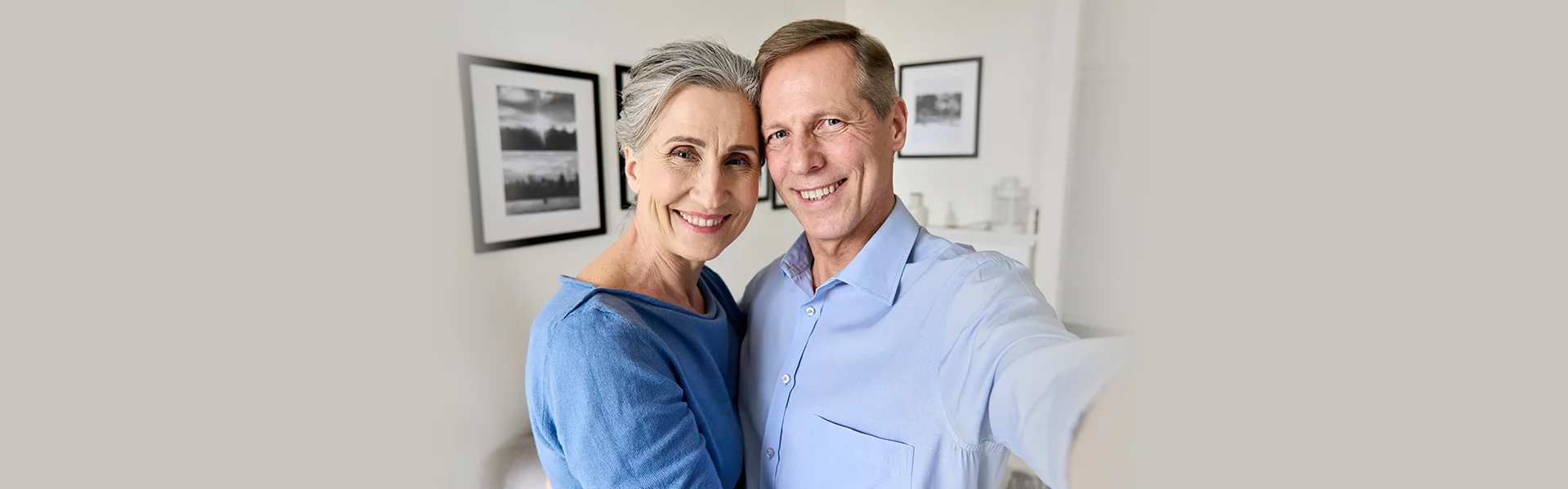 Elderly smiling couple with healthy teeth.