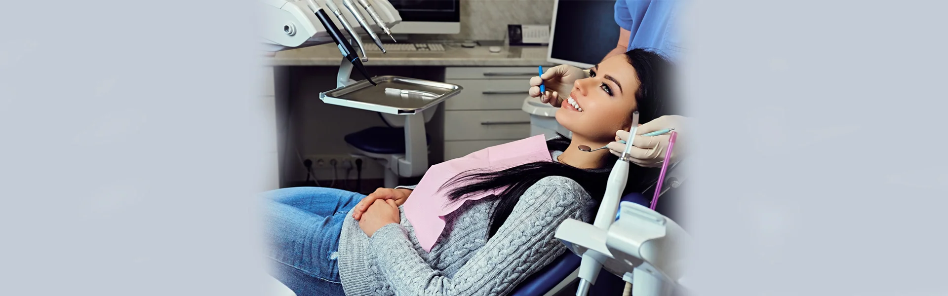 Smiling girl undergoing dental treatment at Ajax dental clinic, ON.