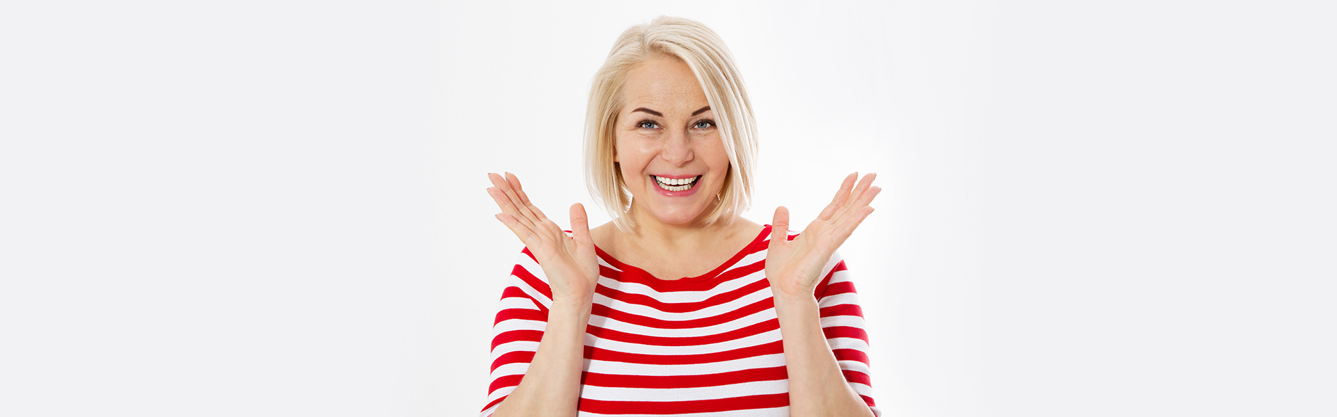 Happy girl in excitement after knowing the importance of bone grafting for getting a dental implant in Ajax, Ontario.