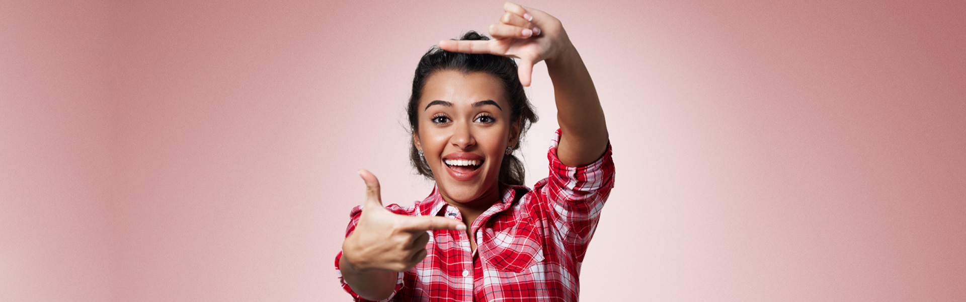 Girl flaunting a beautiful teeth after getting dental implants.