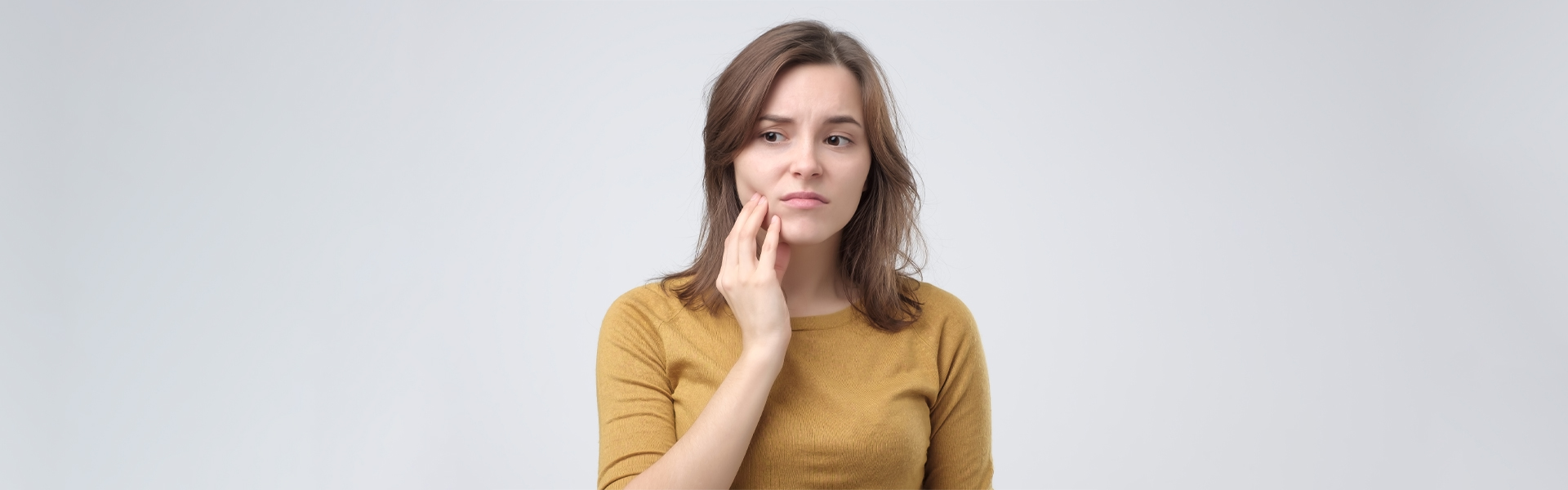 Girl suffering from teeth pain