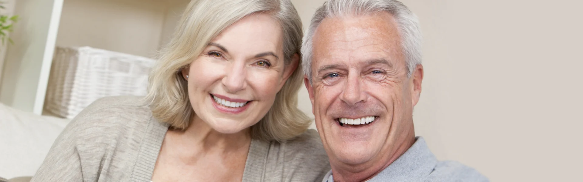 Happy smiling elderly couple wearing dentures in Ajax, ON.
